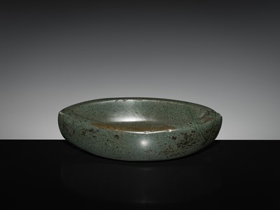 Lot 189 - A DARK GREEN STONE EYE-SHAPED MORTAR AND PESTLE