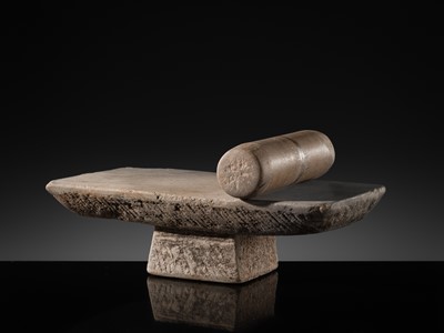 Lot 7 - A SANDSTONE PESANI (GRINDING STONE) AND GRINDER, ANGKOR PERIOD