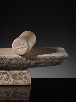 Lot 7 - A SANDSTONE PESANI (GRINDING STONE) AND GRINDER, ANGKOR PERIOD