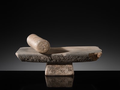 Lot 7 - A SANDSTONE PESANI (GRINDING STONE) AND GRINDER, ANGKOR PERIOD