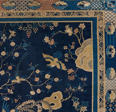 Lot 514 - A LARGE PEKING WOOL ‘ONE HUNDRED BIRDS WORSHIPPING THE PHOENIX’ CARPET, LATE QING DYNASTY