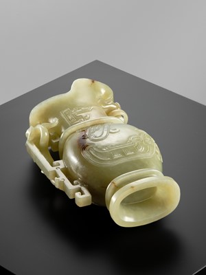 Lot 107 - A YELLOW JADE ARCHAISTIC ‘DRAGON AND PHOENIX’ EWER, GONG, QIANLONG PERIOD