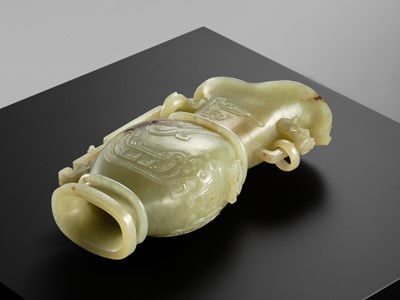 Lot 107 - A YELLOW JADE ARCHAISTIC ‘DRAGON AND PHOENIX’ EWER, GONG, QIANLONG PERIOD