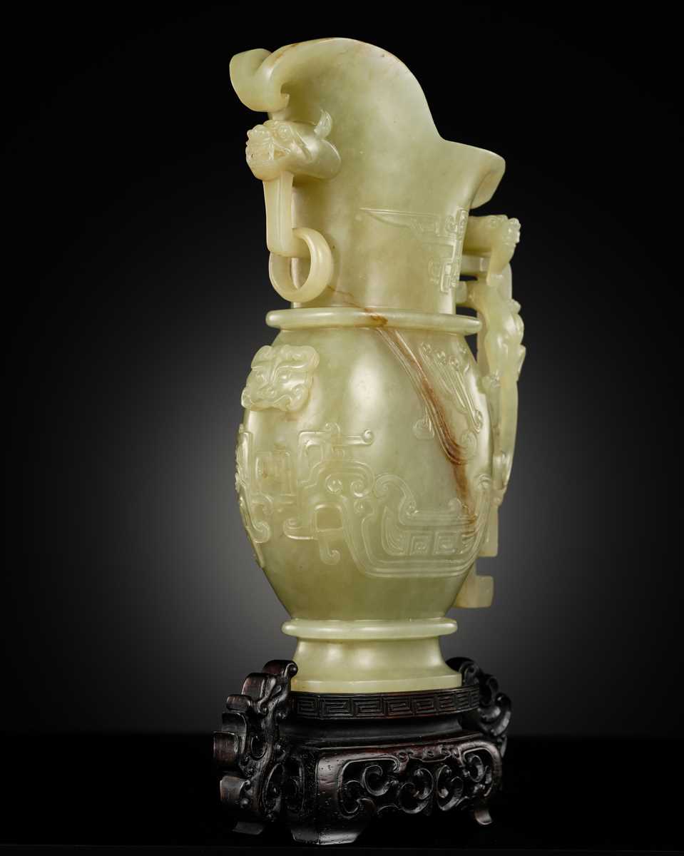 Lot 107 - A YELLOW JADE ARCHAISTIC ‘DRAGON AND PHOENIX’ EWER, GONG, QIANLONG PERIOD