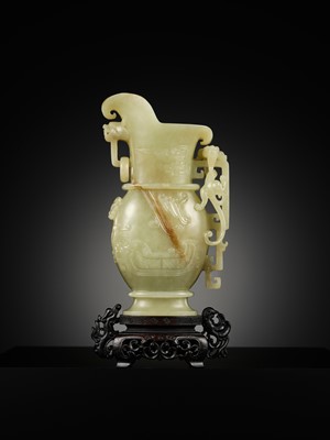 Lot 107 - A YELLOW JADE ARCHAISTIC ‘DRAGON AND PHOENIX’ EWER, GONG, QIANLONG PERIOD