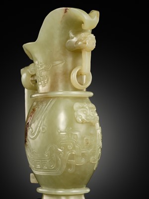 Lot 107 - A YELLOW JADE ARCHAISTIC ‘DRAGON AND PHOENIX’ EWER, GONG, QIANLONG PERIOD