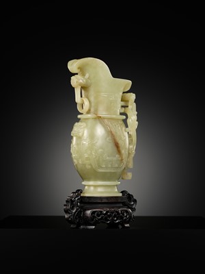 Lot 107 - A YELLOW JADE ARCHAISTIC ‘DRAGON AND PHOENIX’ EWER, GONG, QIANLONG PERIOD