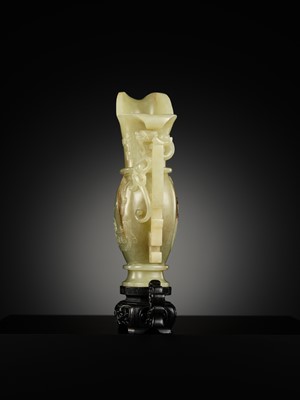 Lot 107 - A YELLOW JADE ARCHAISTIC ‘DRAGON AND PHOENIX’ EWER, GONG, QIANLONG PERIOD