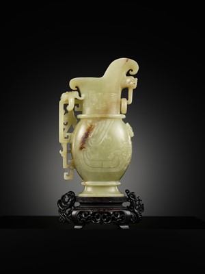 Lot 107 - A YELLOW JADE ARCHAISTIC ‘DRAGON AND PHOENIX’ EWER, GONG, QIANLONG PERIOD