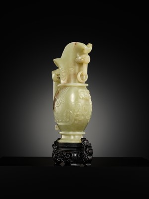 Lot 107 - A YELLOW JADE ARCHAISTIC ‘DRAGON AND PHOENIX’ EWER, GONG, QIANLONG PERIOD