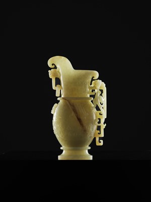 Lot 107 - A YELLOW JADE ARCHAISTIC ‘DRAGON AND PHOENIX’ EWER, GONG, QIANLONG PERIOD