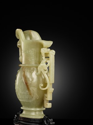 Lot 107 - A YELLOW JADE ARCHAISTIC ‘DRAGON AND PHOENIX’ EWER, GONG, QIANLONG PERIOD