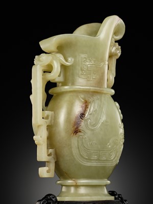 Lot 107 - A YELLOW JADE ARCHAISTIC ‘DRAGON AND PHOENIX’ EWER, GONG, QIANLONG PERIOD