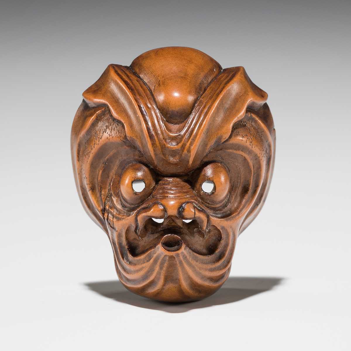 Lot 549 - A WOOD MASK NETSUKE OF AN OCTOPUS-USOFUKI, ATTRIBUTED TO KOKEISAI SANSHO
