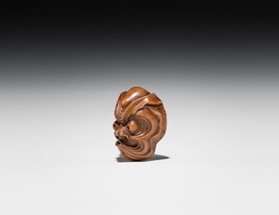 Lot 549 - A WOOD MASK NETSUKE OF AN OCTOPUS-USOFUKI, ATTRIBUTED TO KOKEISAI SANSHO