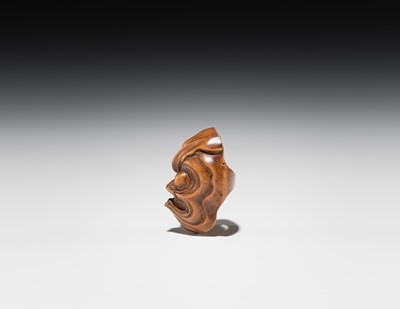 Lot 549 - A WOOD MASK NETSUKE OF AN OCTOPUS-USOFUKI, ATTRIBUTED TO KOKEISAI SANSHO