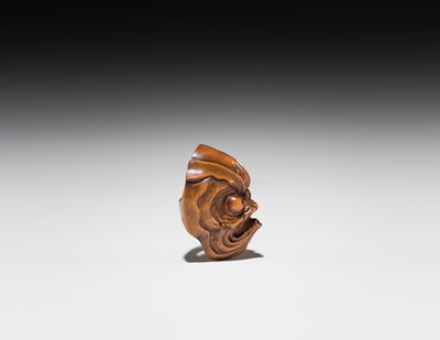 Lot 549 - A WOOD MASK NETSUKE OF AN OCTOPUS-USOFUKI, ATTRIBUTED TO KOKEISAI SANSHO