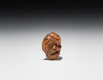 Lot 549 - A WOOD MASK NETSUKE OF AN OCTOPUS-USOFUKI, ATTRIBUTED TO KOKEISAI SANSHO