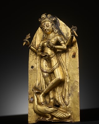 Lot 313 - A GILT-COPPER REPOUSSÉ PLAQUE DEPICTING KUMARI, NEPAL, 16TH-17TH CENTURY