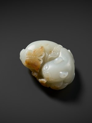 Lot 945 - A WHITE AND RUSSET JADE CARVING OF A CAT WITH BUTTERFLY AND LINGZHI