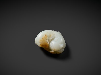 Lot 945 - A WHITE AND RUSSET JADE CARVING OF A CAT WITH BUTTERFLY AND LINGZHI