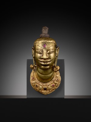 Lot 240 - AN EXCEEDINGLY RARE CHAM GOLD AND SILVER REPOUSSÉ HEAD OF SHIVA, LINGAKOSHA