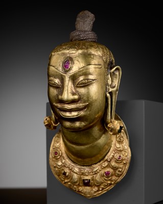 Lot 240 - AN EXCEEDINGLY RARE CHAM GOLD AND SILVER REPOUSSÉ HEAD OF SHIVA, LINGAKOSHA