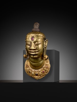 Lot 240 - AN EXCEEDINGLY RARE CHAM GOLD AND SILVER REPOUSSÉ HEAD OF SHIVA, LINGAKOSHA