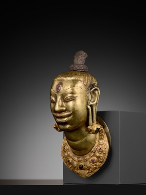 Lot 240 - AN EXCEEDINGLY RARE CHAM GOLD AND SILVER REPOUSSÉ HEAD OF SHIVA, LINGAKOSHA