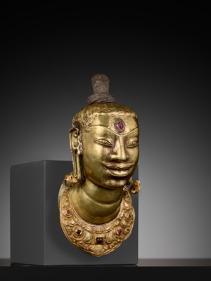 Lot 240 - AN EXCEEDINGLY RARE CHAM GOLD AND SILVER REPOUSSÉ HEAD OF SHIVA, LINGAKOSHA