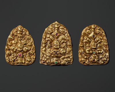 Lot 242 - A GROUP OF THREE GOLD REPOUSSÉ AND GEMSTONE-SET ‘GARUDA’ CROWN ORNAMENTS