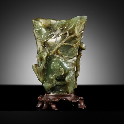 Lot 470 - A SPINACH-GREEN JADE ‘LINGZHI AND BAMBOO’ RHYTON, 18TH-19TH CENTURY