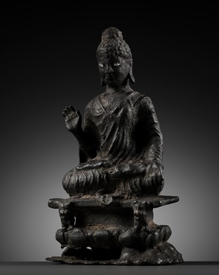 AN IMPORTANT SILVER-INLAID BRONZE FIGURE OF BUDDHA SHAKYAMUNI, GANDHARA, 6TH-7TH CENTURY