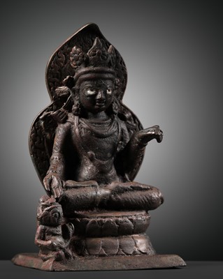 Lot 174 - A SILVER-INLAID COPPER ALLOY FIGURE OF RATNASAMBHAVA, KASHMIR, 7TH-9TH CENTURY