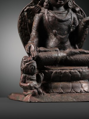 Lot 174 - A SILVER-INLAID COPPER ALLOY FIGURE OF RATNASAMBHAVA, KASHMIR, 7TH-9TH CENTURY