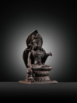 Lot 174 - A SILVER-INLAID COPPER ALLOY FIGURE OF RATNASAMBHAVA, KASHMIR, 7TH-9TH CENTURY