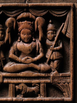 Lot 189 - A SANDALWOOD VOTIVE PLAQUE OF A CROWNED BUDDHA, WEST INDIA, 1ST MILLENNIUM AD