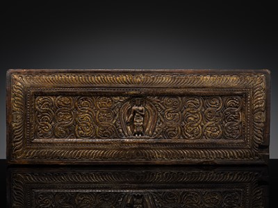 Lot 287 - A LARGE AND GILT WOOD MANUSCRIPT COVER, TIBET, 15TH-16TH CENTURY