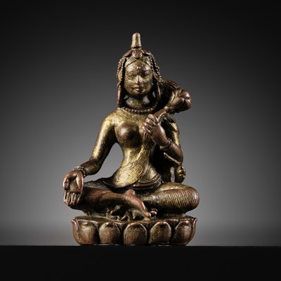 Lot 2 - A MINIATURE GILT COPPER ALLOY FIGURE OF SARASVATI, ATTRIBUTED TO CHÖYING DORJE AND HIS ATELIER, SECOND HALF OF THE 17TH CENTURY