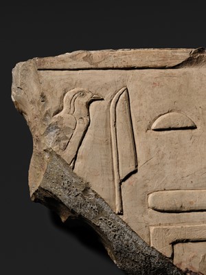 Lot 24 - A WALL RELIEF FRAGMENT DEPICTING AN IBIS, PTOLEMAIC PERIOD
