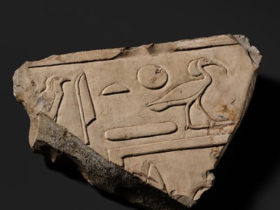 Lot 24 - A WALL RELIEF FRAGMENT DEPICTING AN IBIS, PTOLEMAIC PERIOD
