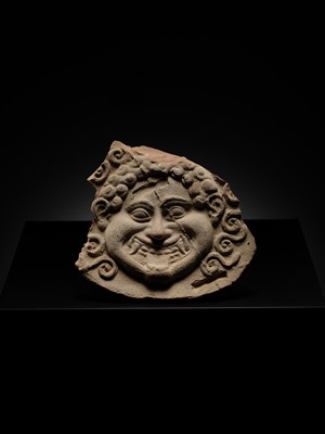 Lot 80 - A TERRACOTTA GORGONEION ANTEFIX