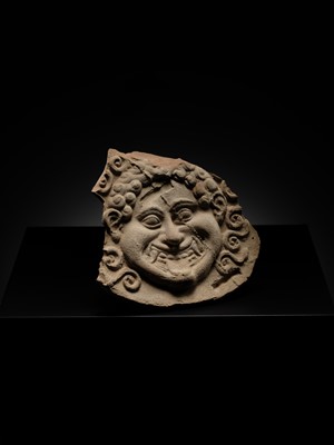 Lot 80 - A TERRACOTTA GORGONEION ANTEFIX