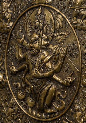 Lot 304 - A BRONZE REPOUSSÉ ‘WRATHFUL DEITY’ VOTIVE PLAQUE, TIBET, 18TH-19TH CENTURY