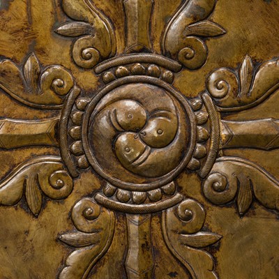 Lot 304 - A BRONZE REPOUSSÉ ‘WRATHFUL DEITY’ VOTIVE PLAQUE, TIBET, 18TH-19TH CENTURY