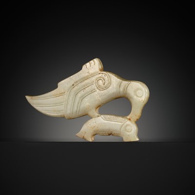 Lot 99 - A YELLOW JADE PENDANT WITH A CORMORANT EATING A FISH, LATE SHANG DYNASTY