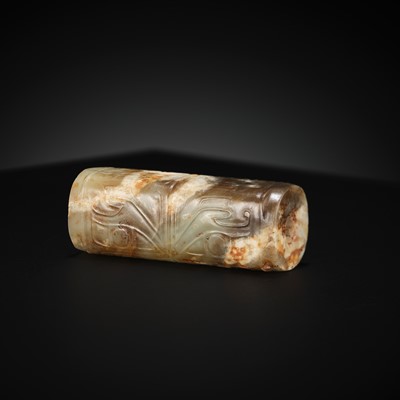 Lot 100 - A ‘TAOTIE’ CYLINDRICAL JADE BEAD, LATE SHANG TO EARLY WESTERN ZHOU DYNASTY