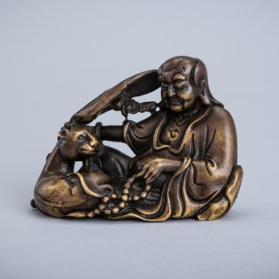 Lot 1571 - A BRONZE FIGURE OF A LUOHAN WITH A TIGER, 17TH-18TH CENTURY