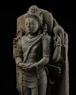 Lot 218 - A VOLCANIC STONE RELIEF DEPICTING SHIVA MAHADEVA, CENTRAL JAVA, 9TH CENTURY