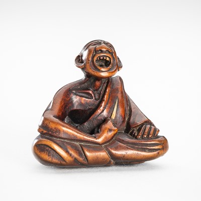 Lot 1606 - HOKEI: A FINE WOOD NETSUKE OF A PROFESSIONAL SNEEZER